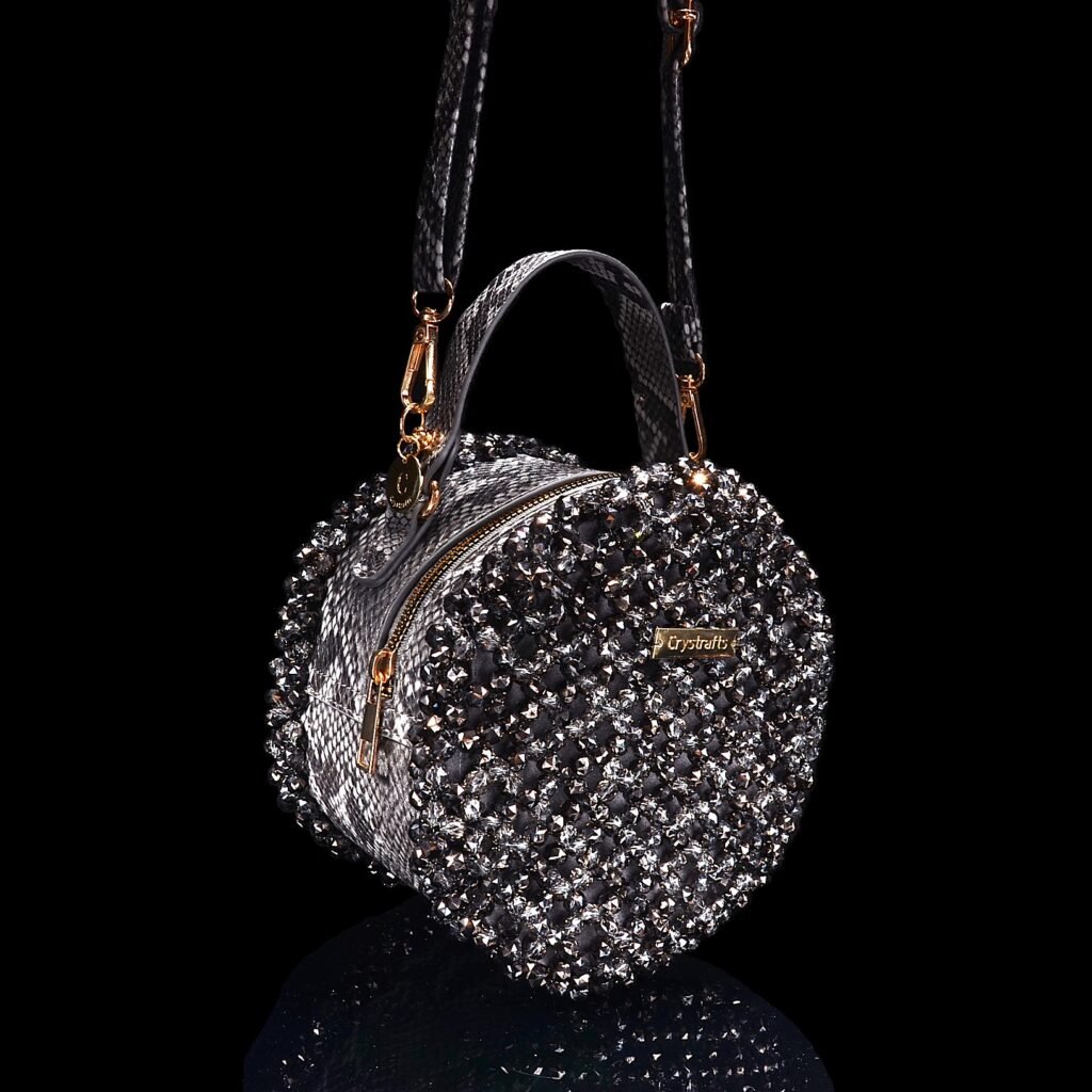 Side View of Handmade Snakeskin Crystal Round Bag with Leather Shoulder